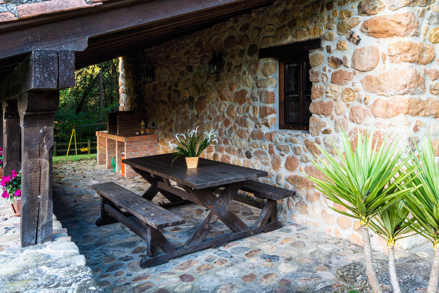 Picnic bench by barbecue area