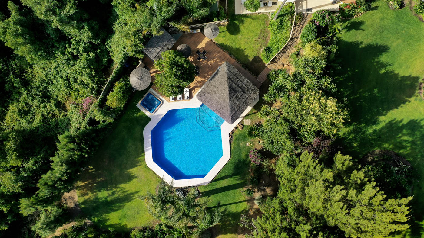 Pool and gardens seen from a drone