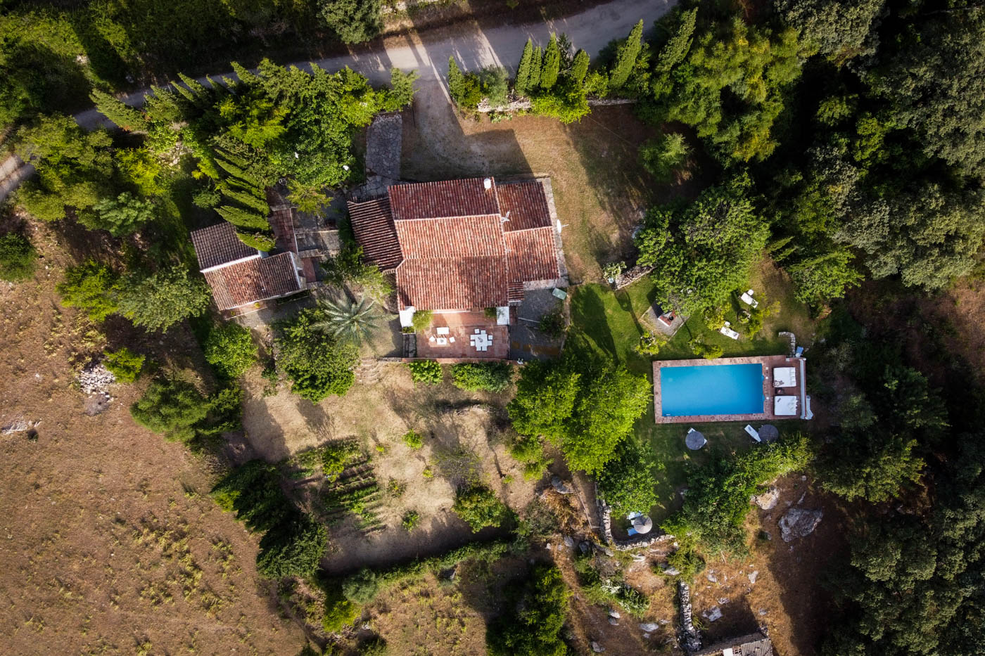Villa, gardens and pool seen from above