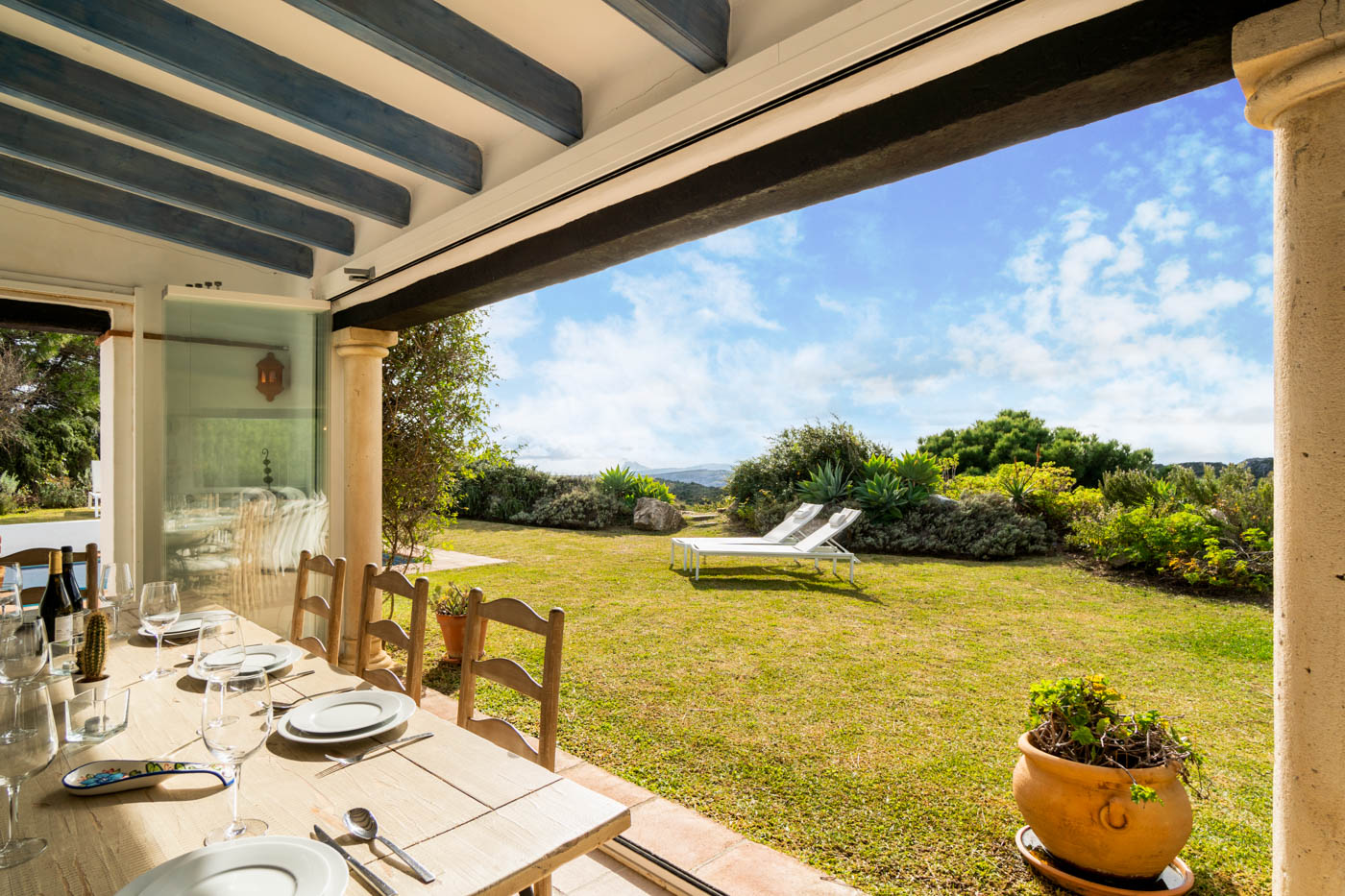 Furnished porch with outdoor dining facilities