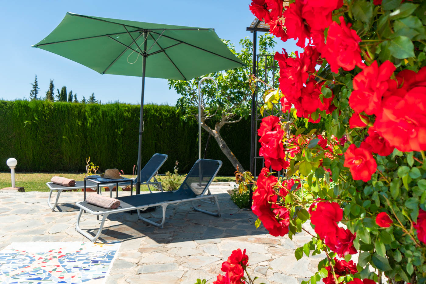 Sunbathe or relax under the parasol shade