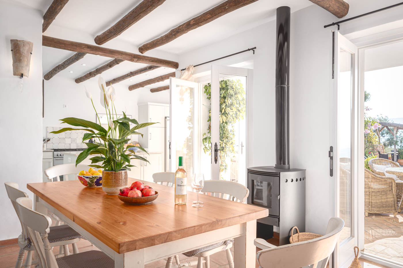 Dining room / kitchen with doors opening to terraces