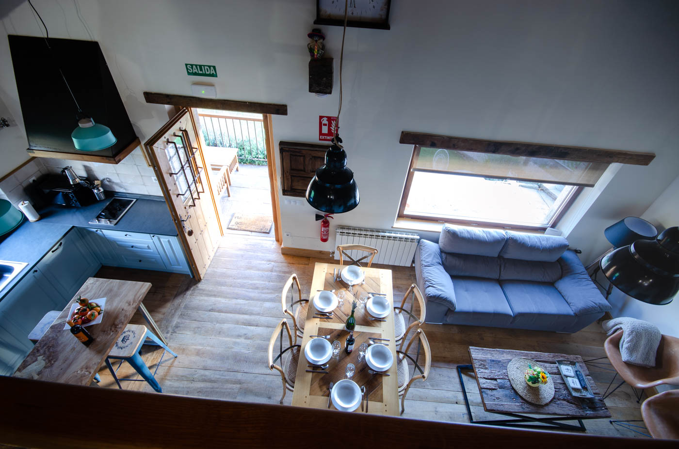 Open plan kitchen/dining/living seen from gallery room