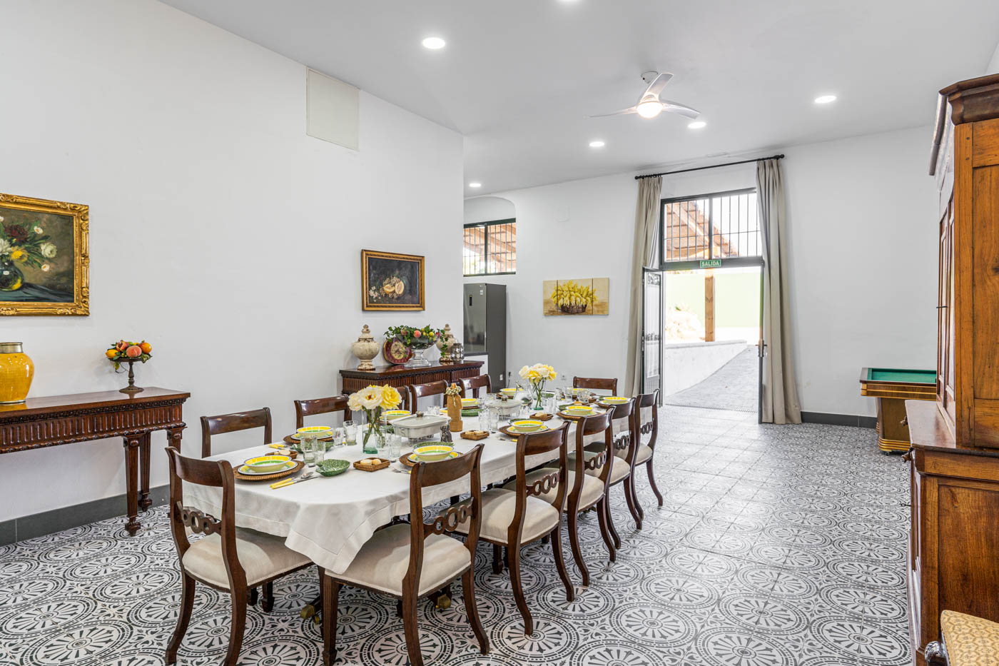 Open plan kitchen/dining with doors to barbecue area