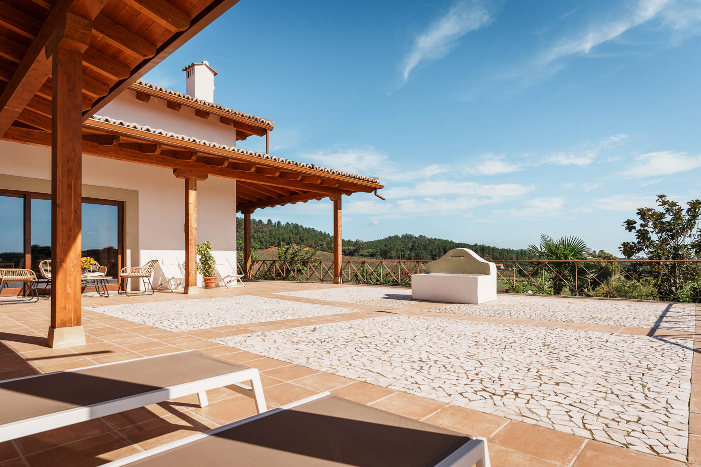 Porch with outdoor furniture by main patio