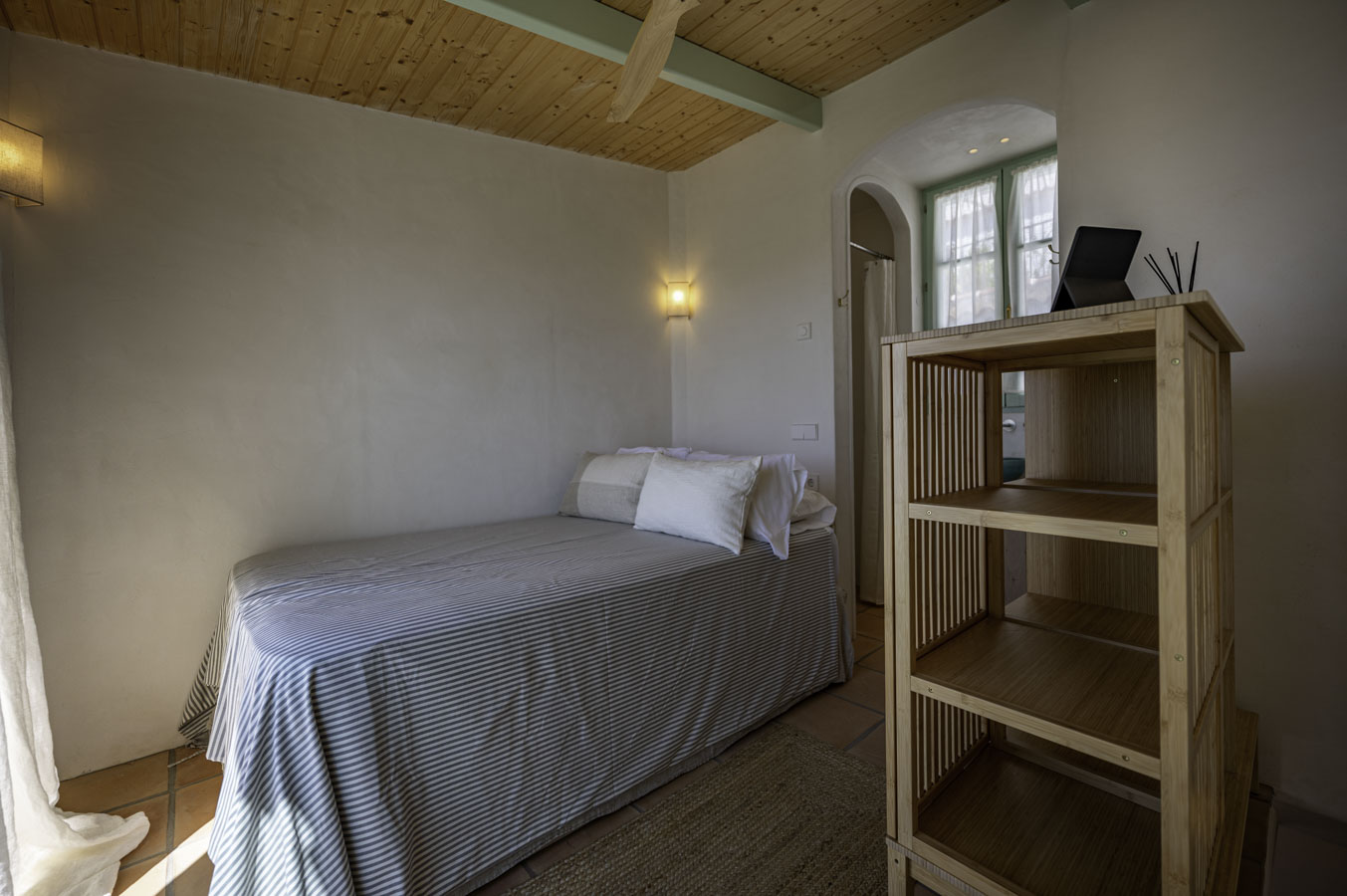 Bedroom with large single bed on third floor