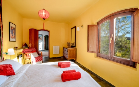 Master bedroom with double bed and walk in wardrobe