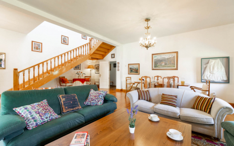 Large living area, dining table and stairs to 1st floor
