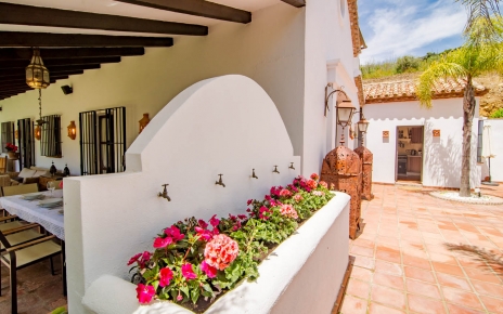 Patio leads to large furnished porch