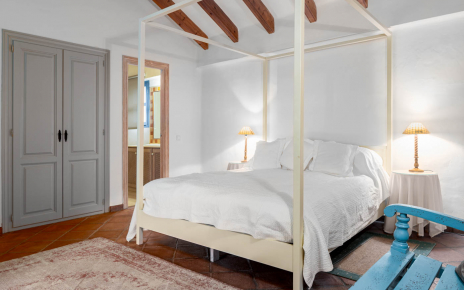 Bedroom 1 with en suite facilities and doors to patio