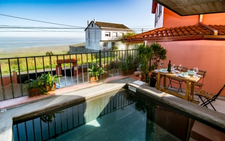 Sitting by the small pool with sea views