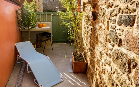 Small patio with barbecue next to kitchen
