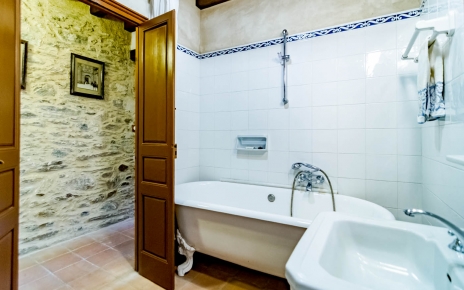Bathroom with old tub and shower over