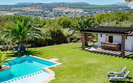 Pool bar and lawned gardens seen from 1st floor terrace