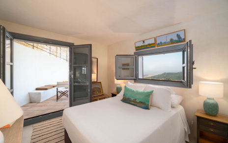 Bedroom with doors to furnished patio