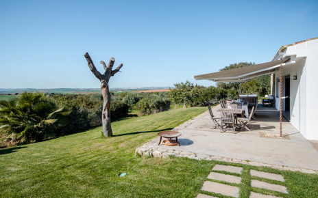 Furnished terrace with awning along the house