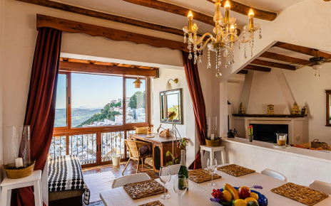 Open plan living / dining area with balconies and views