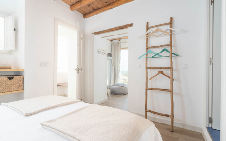 Bedroom with en suite facilities and living area with views