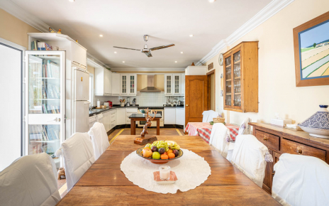 Open plan kitchen / dining with doors to terraces