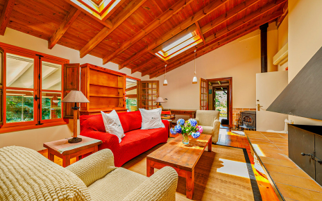 Ground floor living area with open fire and woodburner