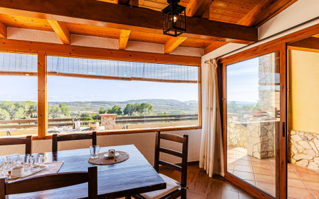 The kitchen is on the other side of the dining room