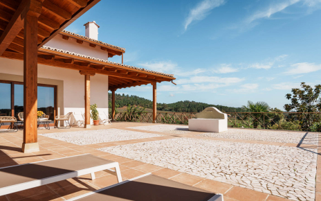 Porch with outdoor furniture by main patio