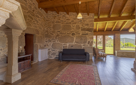 Large living space with doors opening to gardens