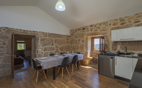 There is a living room next to kitchen/dining area