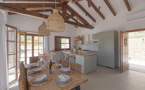 Dining area / kitchen and main door on the right