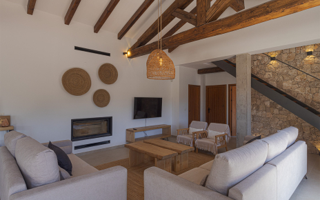 Living area with glass fronted fireplace