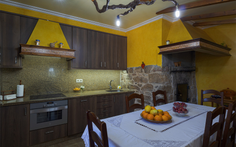 The kitchen also has an indoor wood oven