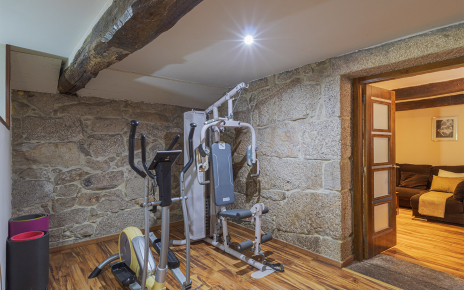 Gym with doors to another sitting room
